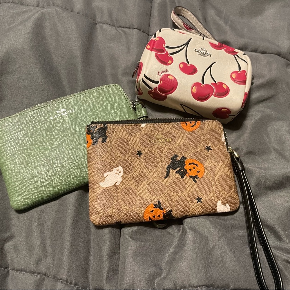Coach Cherry, Green, and Halloween Wristlet Trio
